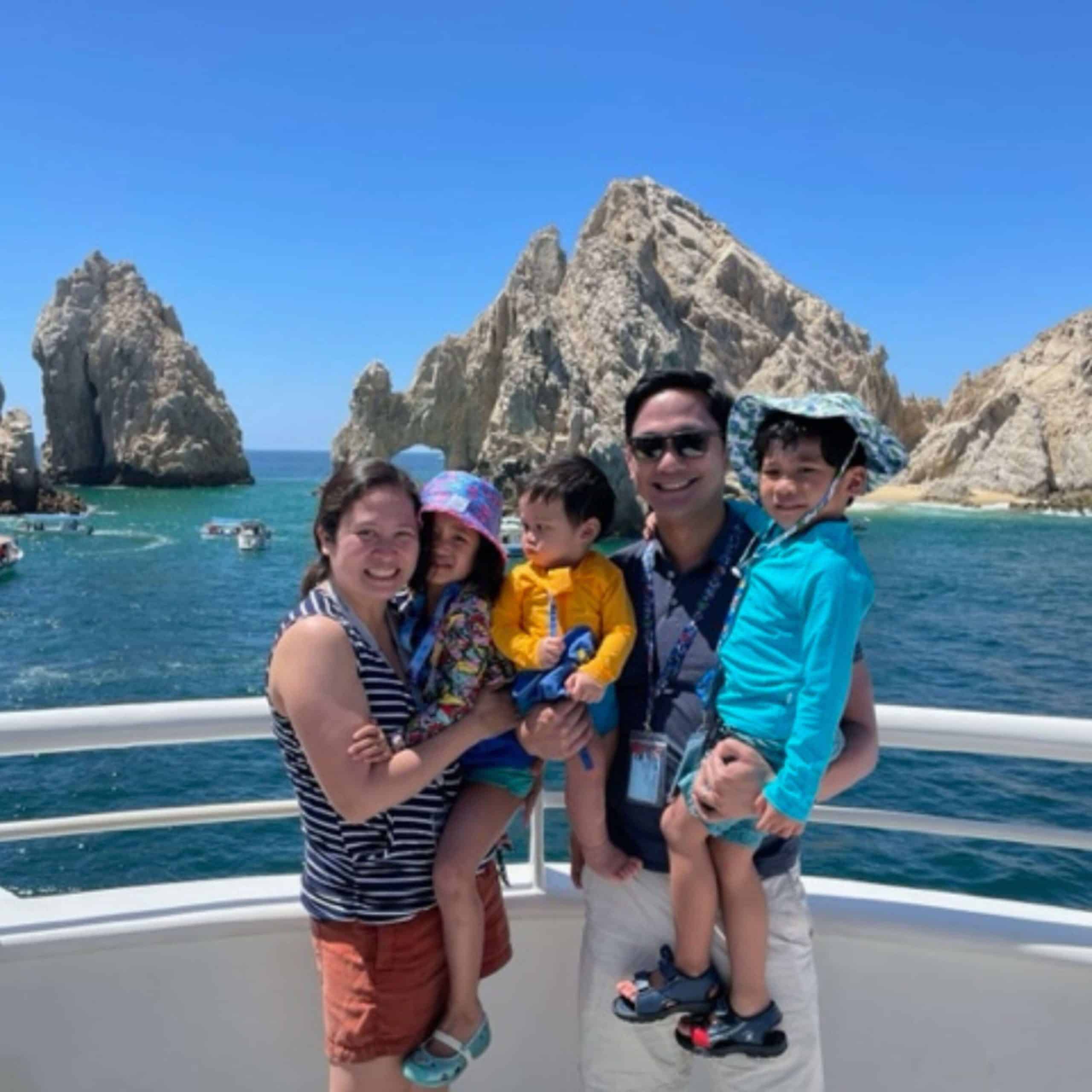 Family on a boat in cabo san lucas.