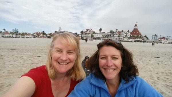 Two women taking a selfie on the beach.