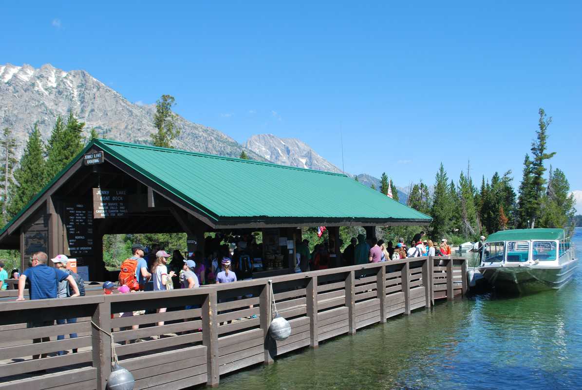 People on dock waiting for boat ride on Jenny Lake