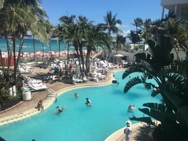 A view of the pool at a lively hotel in Miami, perfect for your spring break getaway.