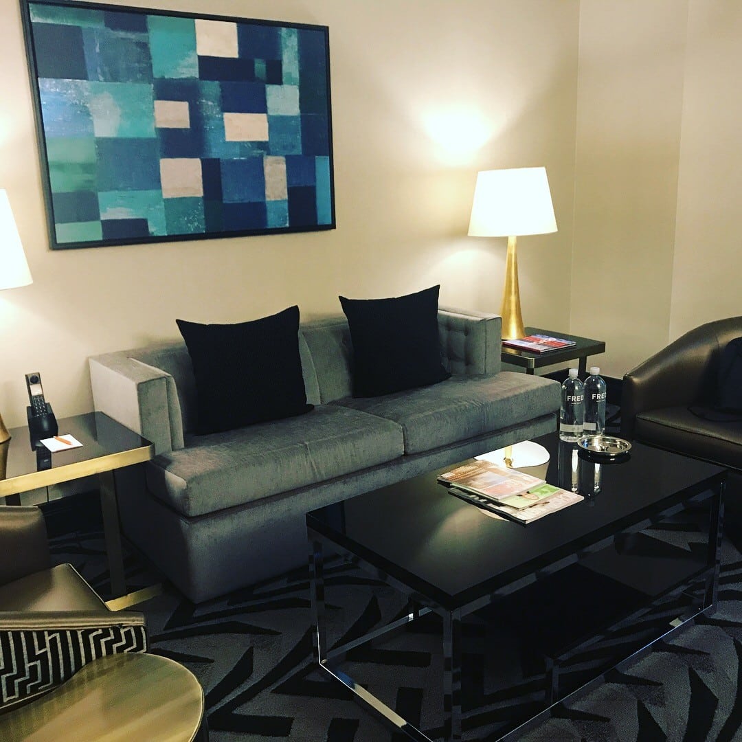 Sofa and table in guest room at Hotel Allegro Chicago