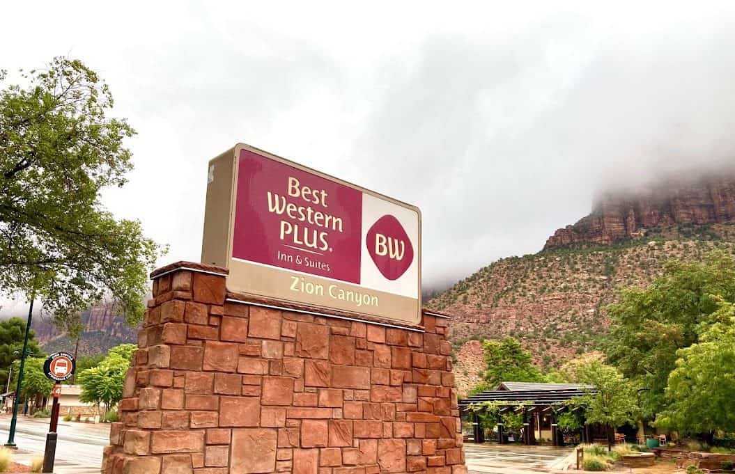 A sign for the best western along a road trip in Zion, Arizona.