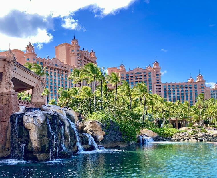 Atlantis hotel in Nassau Bahamas. View of building with waterfall and pond in front in Nassau Bahamas