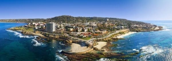 An aerial view of a city near the ocean.