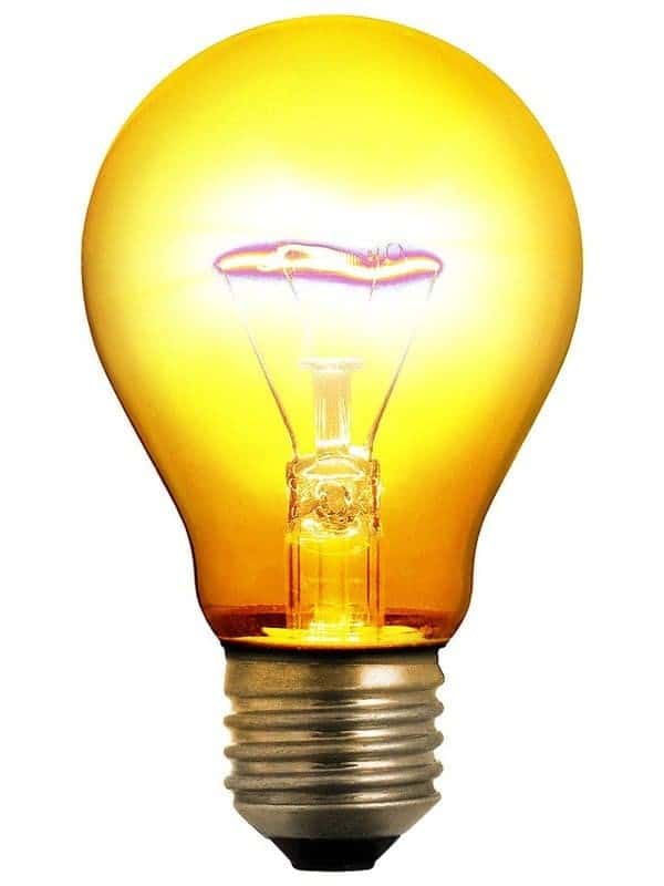 A yellow light bulb on a white background.