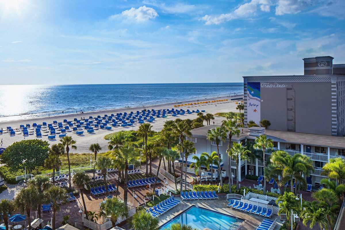 An aerial view of Tradewinds Island Grand Resort featuring a pool and beach.