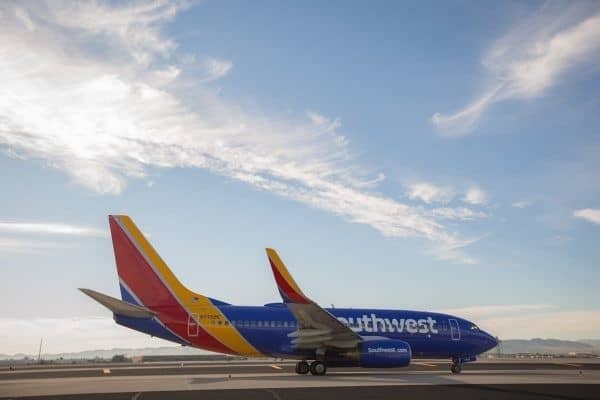 A southwest airlines plane sits on the tarmac.