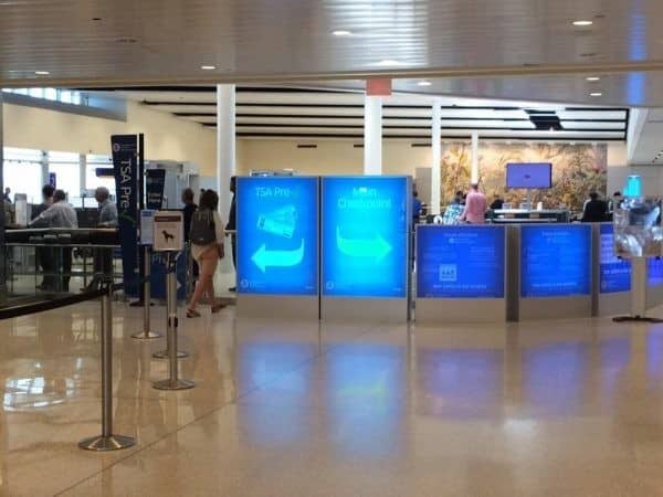 A group of Chase Sapphire cardholders waiting to check-in at an airport.