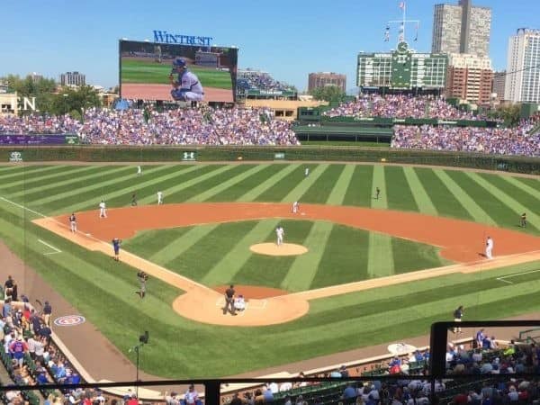 The chicago cubs are playing a baseball game in a stadium.