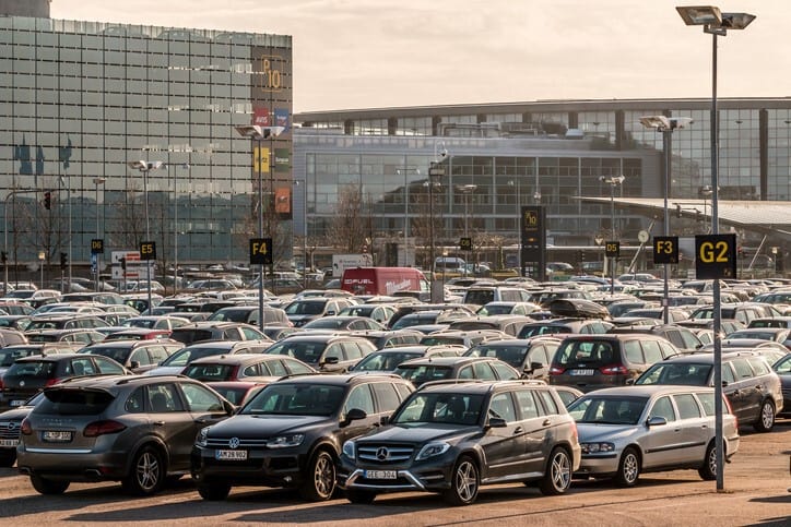 A lot of cars parked in a parking lot.