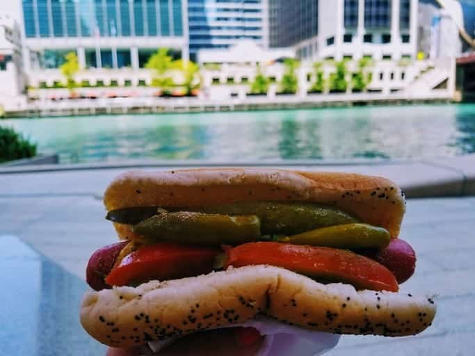 chicago hot dog in front of the Chicago River