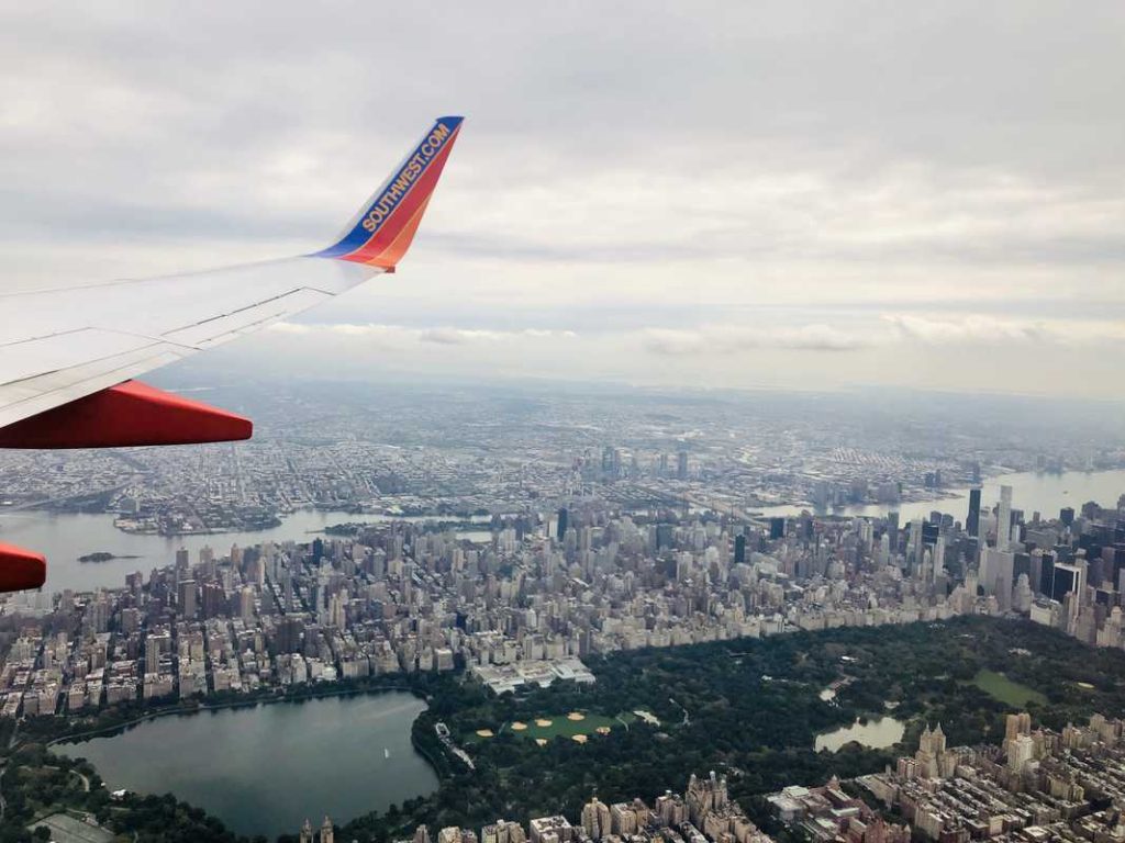 An airplane flying over New York City.