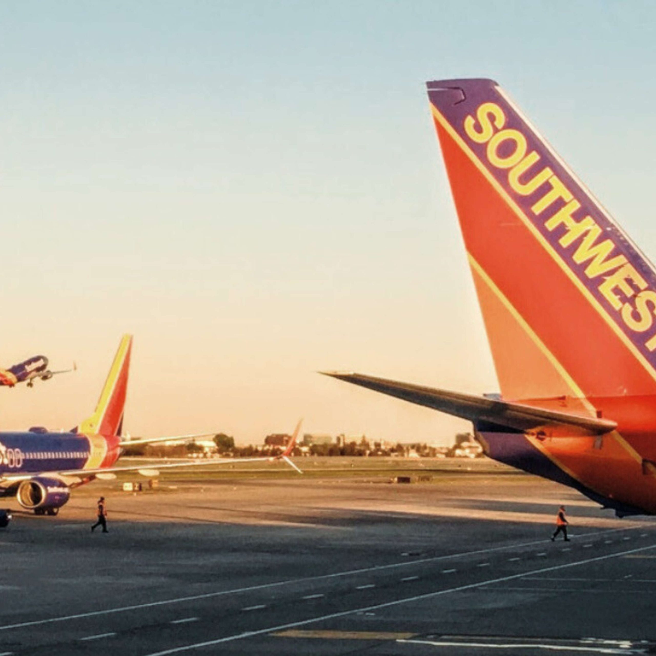 Southwest airlines planes on the tarmac at an airport.